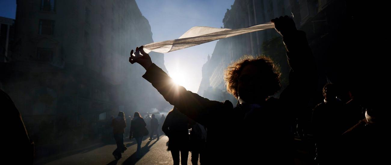 white handkerchief at protest held by woman smoky