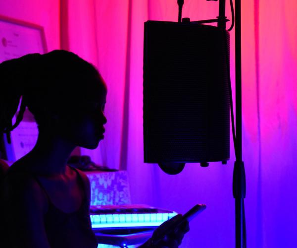 woman sings in music studio